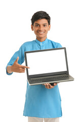 Indian child wearing traditional cloth and showing laptop screen