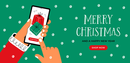 Christmas banner with hands holding smartphone with gift boxes on the screen. Fast online delivery gifts concept. - 473726029