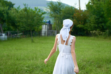 Woman in white dress countryside village nature ecology