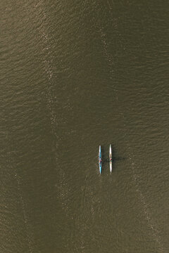 Aerial view of two rowing boats and oarsmen 