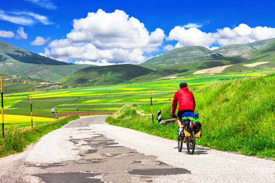 Cycling In Sibilini Mountains(Italy), Outdoor Sport Activiies . Castelluccio Di Norcia, Umbria. Travel By Bike