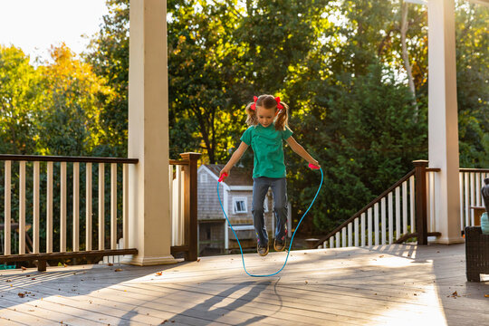 Happy girl Skipping Jump rope at home 