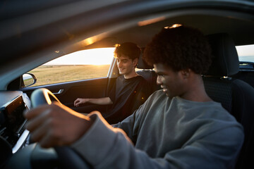 Male friends inside  car