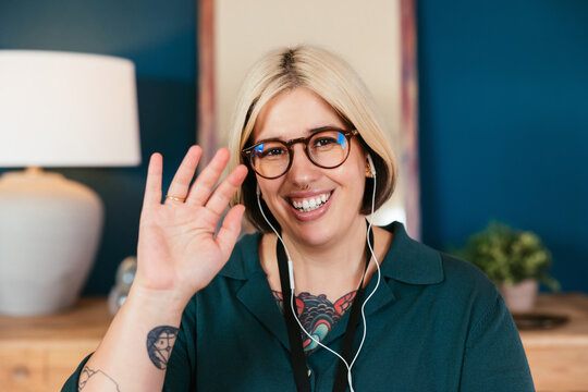 Friendly employee waving hand