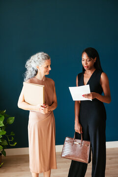 Multiracial lawyers discussing papers