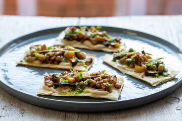 Vegan filo pastry canapes with aubergine and coriander sauce