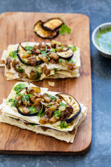 Vegan filo pastry canapes with aubergine and coriander sauce