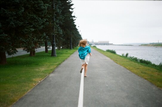 A woman running on a road