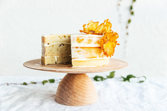 Sliced lemon layer cake on cake stand