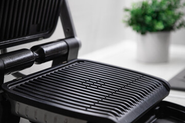 electric grill open empty in the kitchen