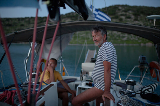 Father And Son On A Sailboat 
