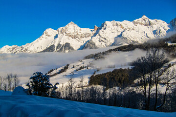 Winter landscape, stunning mountain range, snowy trees and blue sky at Maria Alm, Hinterthal in...