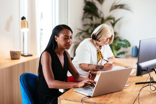 Modern women working at desk