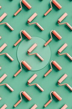 top-down view of paint rollers on green background