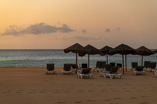 Sun beds at sunset