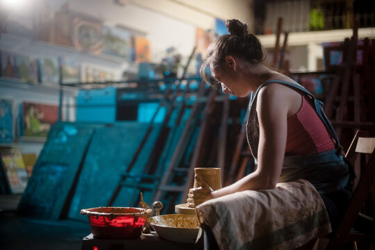 Focussed craftswoman at her art studio