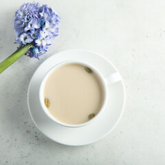 Fototapeta na wymiar Tea with milk and cardamom