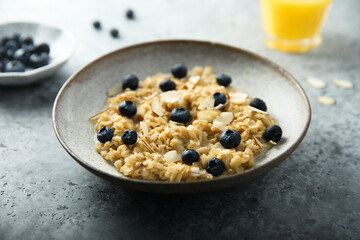 Homemade oatmeal porridge with blueberry and almond flakes