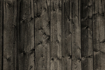 Old rustic fence. The texture of wooden boards.