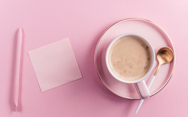 Obraz na płótnie Canvas Morning cup of coffee on pink background.