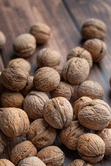 Whole walnuts on a wooden table