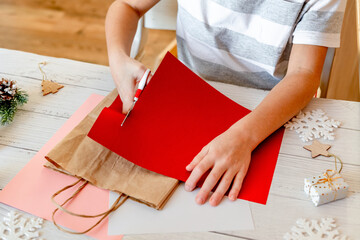 DIY Step-by-step guide instructions for Christmas paper bag for children. New year pack with Santa...
