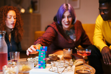 Friends playing game during party