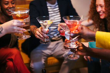 Crop people clinking glasses