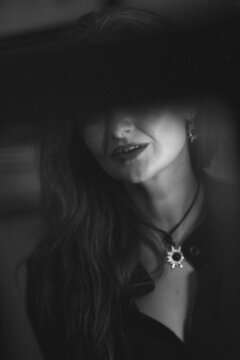 bw portrait of a middle-aged woman with eyes hidden