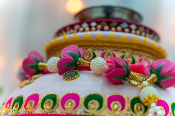 Clay pot decorated with flowers and gems for Indian wedding