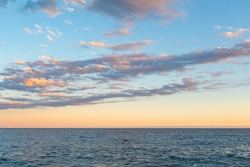 Naklejka na ściany i meble blue sea with sunset view