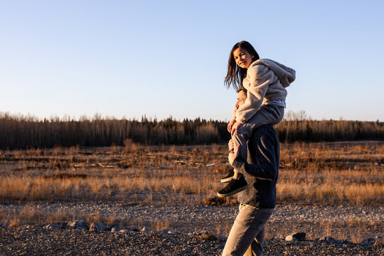 Daughter On Fathers Shoulders