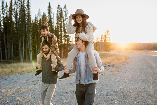Kids Ride On Their Fathers and Brothers Shoulders