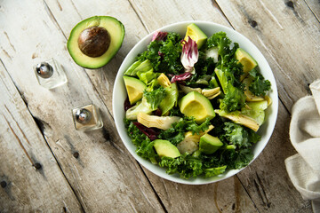 Healthy green salad with artichoke and avocado