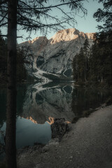 landscape of a lake surrounded by mountains and trees