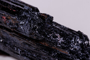 macro mineral stone sherle, schorl, black tourmaline on white background