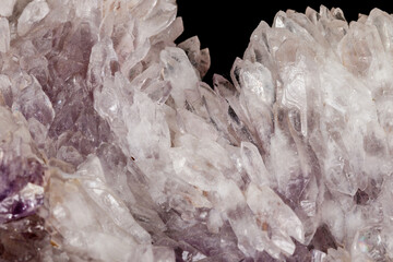 Macro of amethyst mineral stone on black background