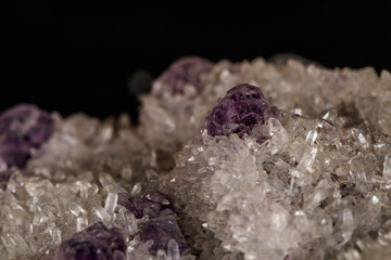 macro mineral fluorite stone on black background