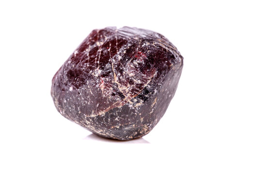 Macro of a mineral garnet stone on a white background