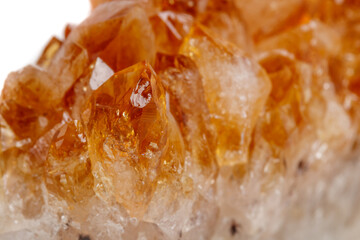 Macro mineral stone Citrine in rock in crystals on a white background