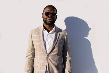 Happy man in elegant suit in the street