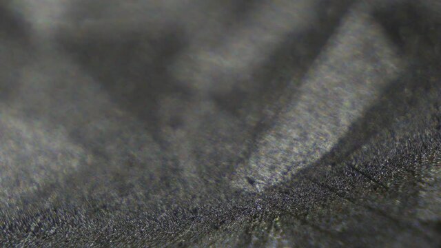 Polished metal texture, shiny zinc sheet micro-texture. Thin galvanic coating. Metal oxidation protection. Black gloss and grey zinc metallic pattern. Geometric tech motion background.