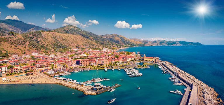Aerial landscape photography. Splendid summer view from flying drone of Acciaroli port. Amazing outdoor scene of Mediterraneanm coast of Italy. Traveling concept background.