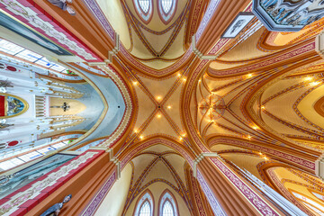  interior dome and looking up into a old gothic catholic  church ceiling