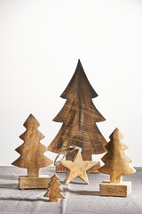 Set of christmas wood decorations on the table (wooden trees and stars), xmas ornament. Vintage...