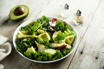 Healthy green salad with artichoke and avocado