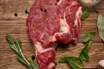 meat on a wooden table pepper ingredients cooking protein