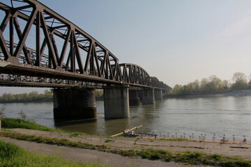 Fototapeta na wymiar Iron bridge on the Po river in Italy