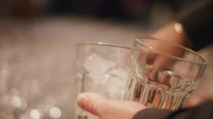waiter preparing cocktails. glass of alcohol free red drink with ice. Concept of live event