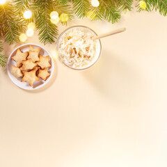 Holiday Christmas desserts eggnog and ginger cookie stars on beige. View from above. Copy space.